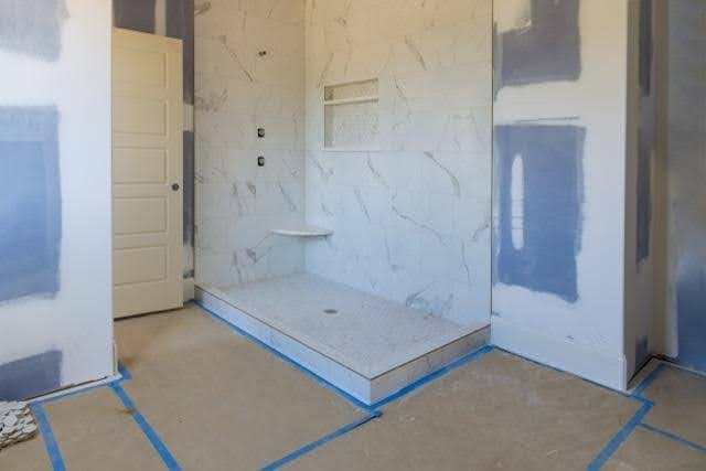 A bathroom with blue paint details and white walls offering a clean and contemporary design