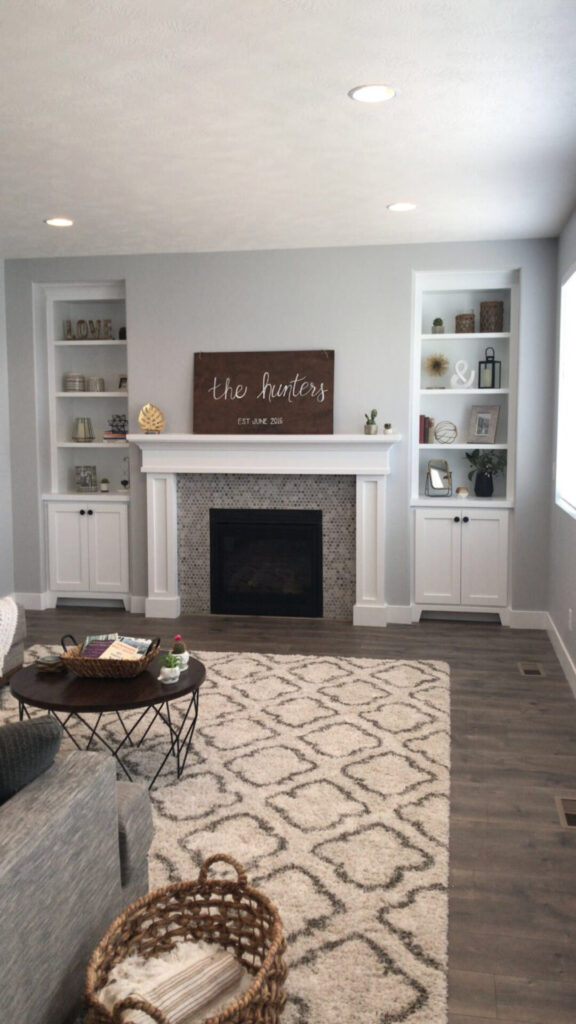 A warm living room scene showcasing a fireplace a decorative rug and inviting furniture